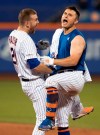 New York Mets' J.D. Davis, right, celebrates with Todd Frazier (21) after Davis drove in the game-winning run with a single during the 10th inning of the team's baseball game against the Cleveland Indians on Wednesday, Aug. 21, 2019, in New York. The Mets won 4-3. (AP Photo/Mary Altaffer)