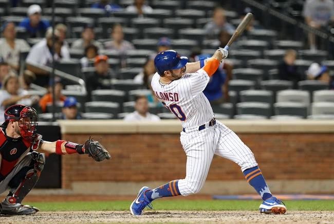 New York Mets' Pete Alonso hits a two-run double during the eighth inning of a baseball game against the Atlanta Braves, Sunday, June 30, 2019, in New York. (AP Photo/Kathy Willens)