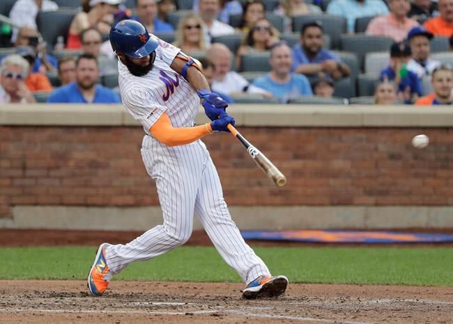 New York Mets' Amed Rosario hits a double during the fourth inning of the team's baseball game against the Atlanta Braves on Saturday, June 29, 2019, in New York. (AP Photo/Frank Franklin II)