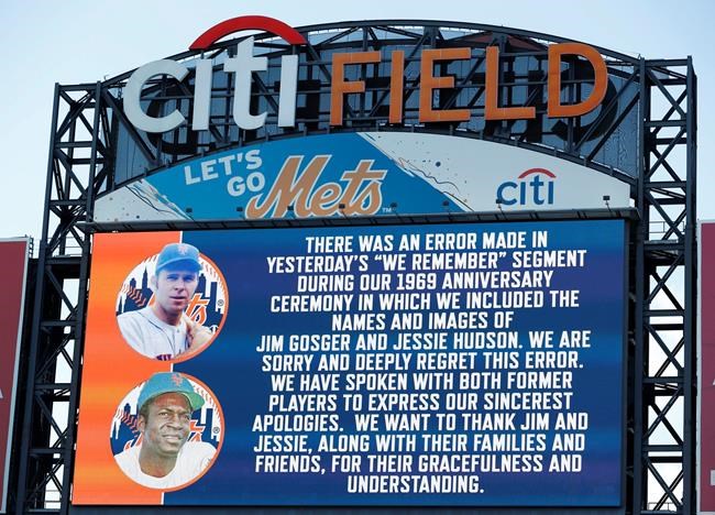 The New York Mets apologize for a gaffe in including the names and photos of Jim Gosger and Jessie Hudson, two members of the 1969 Mets who were memorialized in a Saturday ceremony honoring the World Series-winning team, before a baseball game between the New York Mets and the Atlanta Braves, Sunday, June 30, 2019, in New York. Both Gosger and Hudson are still alive. (AP Photo/Kathy Willens)