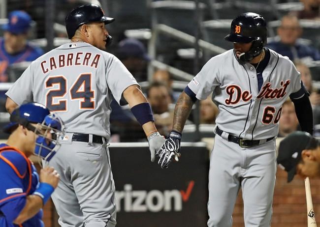 Detroit Tigers on-deck batter Ronny Rodriguez congratulates teammate Miguel Cabrera (24) after Cabrera hit a solo home run during the fifth inning of a baseball game against the New York Mets, Friday, May 24, 2019, in New York. (AP Photo/Kathy Willens)