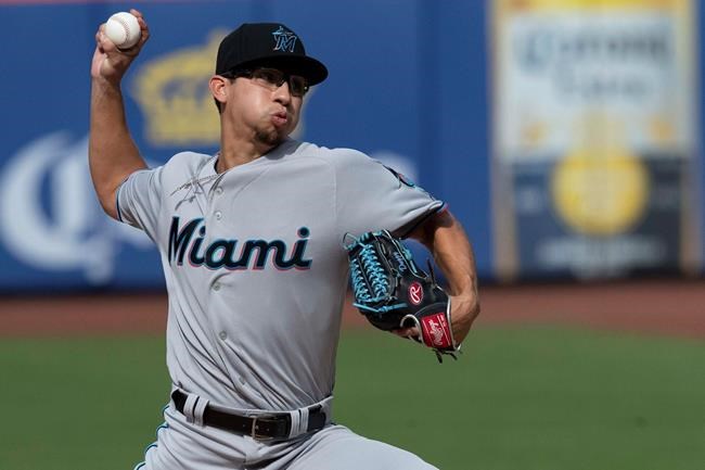Miami Marlins starting pitcher Robert Dugger delivers in his major league debut during the first inning of a baseball game against the New York Mets, Monday, Aug. 5, 2019, in New York. (AP Photo/Mary Altaffer)