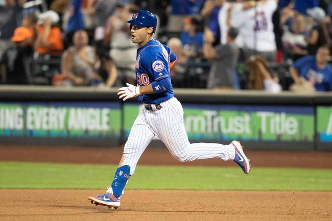 New York Mets' Michael Conforto round the bases after hitting a home run during the seventh inning in the second game of a baseball doubleheader against the Miami Marlins, Monday, Aug. 5, 2019, in New York. (AP Photo/Mary Altaffer)