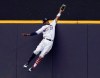FILE - In this July 4, 2018, file photo, Milwaukee Brewers' Keon Broxton makes a leaping catch at the wall on a ball hit by Minnesota Twins' Brian Dozier during the ninth inning of a baseball game in Milwaukee. Everyone has seen an outfielder receive a tip of the cap or a jubilant fist bump from a pitcher after a home run robbery. This is a story about what happens after they leave the field. (AP Photo/Morry Gash, File)