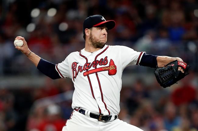 FILE - In this June 19, 2019 file photo Atlanta Braves relief pitcher Anthony Swarzak (38) works in the seventh inning of a baseball game against the New York Mets in Atlanta. Swarzak has been placed on the 10-day injured list with inflammation in his pitching shoulder, a significant blow to the bullpen for the NL East leaders. The move was made Sunday, June 30, 2019 retroactive to Saturday. (AP Photo/John Bazemore)