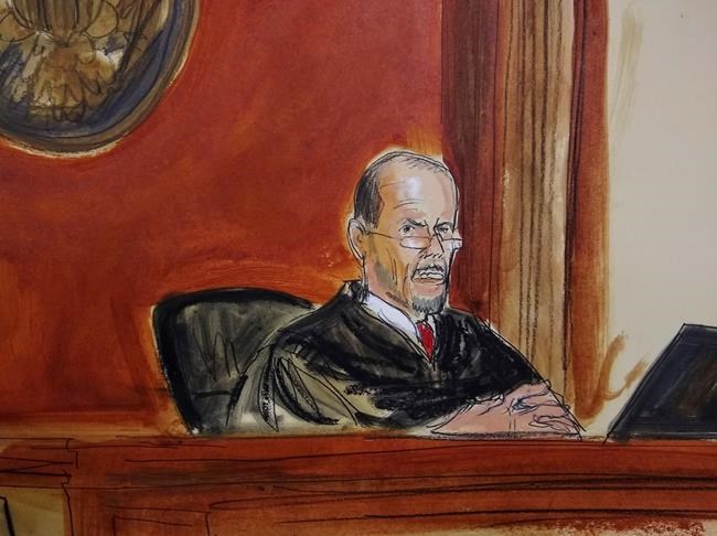 In this courtroom sketch, U.S. District Judge William H. Pauley III sentences Michael Cohen, Wednesday, Dec. 12, 2018, in New York. President Donald Trump's once-devoted lawyer and all-around fixer, was sentenced to three years in prison for allowing what he said was his