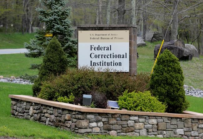 In this May 1, 2019 photo, a sign marks the entrance to the Federal Correctional Institution, Otisville in Mount Hope, N.Y. President Donald Trump's former lawyer and fixer, Michael Cohen, is due to report to the facility on Monday, May 6, 2019, to begin serving a three year sentence for tax evasion, lying to Congress and campaign finance crimes. (AP Photo/Seth Wenig)