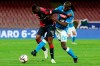Genoas CFC forward Kauma, left, tries to keep the ball against SSC Napoli's defender Kalidou Koulibaly during an Italian Serie A soccer match at the San Paolo stadium in Naples, Italy, Sunday, April 7, 2019. (Cesare Abbate/ANSA via AP)