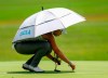 FILE - In this Thursday, May 31, 2018, file photo, Patty Tavatanakit, of Thailand, fixes a divot on the 18th green during the first round of the U.S. Women's Open golf tournament, in Shoal Creek, Ala. Tavatanakit has secured her LPGA Tour card. (AP Photo/Butch Dill, File)