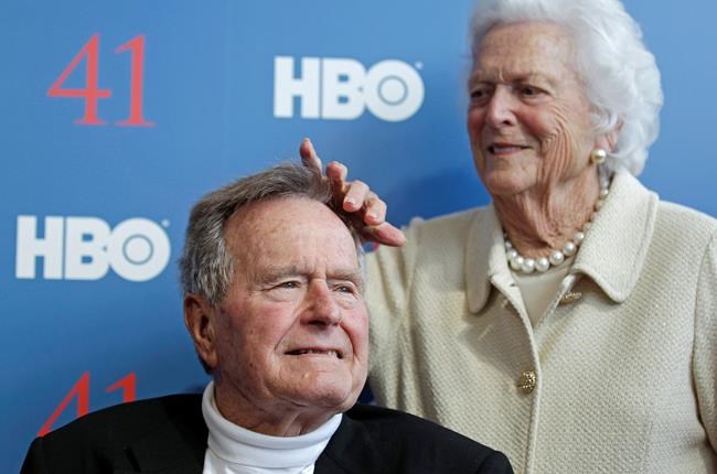 (AP Photo/Charles Krupa, File)
2012 file photo, former first lady Barbara Bush touches the hair of her husband, former President George H.W. Bush, as they arrive for the premiere of HBO's new documentary on his life near the family compound in Kennebunkport, Maine.