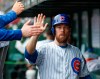FILE - In this Friday, Sept. 28, 2018, file photo, Chicago Cubs' Ben Zobrist celebrates with teammates in a dugout after scoring against the St. Louis Cardinals during the first inning of a baseball game, in Chicago. The Chicago Cubs have activated Zobrist from the restricted list to help with their postseason push. Zobrist has been out since May 8, 2019, while going through a divorce. (AP Photo/Kamil Krzaczynski, File)