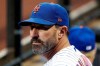 FILE - In this Saturday, Aug. 10, 2019, file photo, New York Mets manager Mickey Callaway watches during the second inning of a baseball game against the Washington Nationals at Citi Field, in New York. A person familiar with the decision says former New York Mets manager Mickey Callaway will be the Los Angeles Angels’ next pitching coach. (AP Photo/Seth Wenig, File)