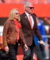 File-This Nov. 4, 2018, file photo shows, Cleveland Browns owners Dee and Jimmy Haslam walk on the field prior to an NFL football game against the Kansas City Chiefs, in Cleveland. The Browns owners have bought the Columbus Crew, guaranteeing the team will not relocate. The Haslams have been working for months with the a group to keep the Major League Soccer franchise in Ohio. (AP Photo/David Richard, File)
