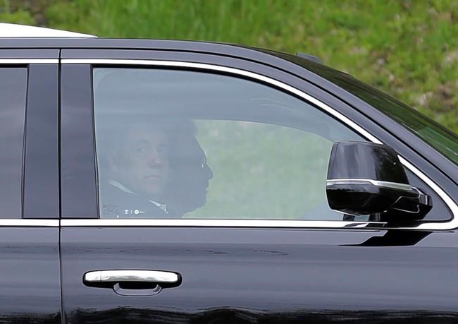 Michael Cohen, President Donald Trump's former personal attorney, looks out the window of his car as he arrives at the Federal Correctional Institution in Otisville, N.Y., Monday, May 6, 2019. Cohen is reporting to the prison to begin serving a three-year sentence for campaign-finance violations, tax evasion, bank fraud and lying to Congress. (AP Photo/Seth Wenig)