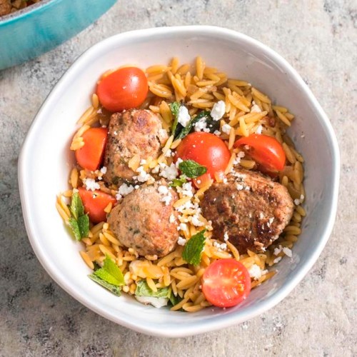 This undated photo provided by America's Test Kitchen in March 2019 shows Lamb Meatballs With Orzo in Brookline, Mass. This recipe appears in the book 