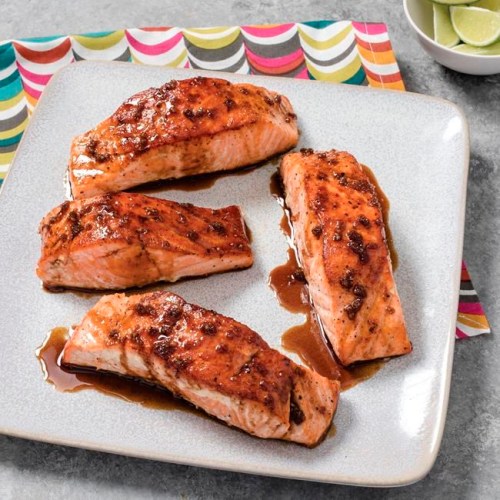 This undated photo provided by America's Test Kitchen in March 2019 shows Sweet And Tangy Glazed Salmon in Brookline, Mass. This recipe appears in 