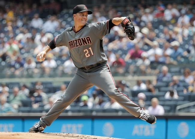 Arizona Diamondbacks' Zack Greinke delivers a pitch during the first inning of a baseball game against the New York Yankees Wednesday, July 31, 2019, in New York. (AP Photo/Frank Franklin II)