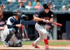 Cleveland Indians' Mike Freeman and New York Yankees' catcher Gary Sanchez, left, watch Freeman's three-run, home run during the second inning of a baseball game, Sunday, Aug. 18, 2019, in New York. (AP Photo/Kathy Willens)