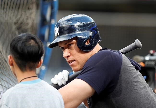 New York Yankees' Aaron Judge, right, talks to a participant in HOPE week before a baseball game against the Houston Astros, Friday, June 21, 2019, in New York. (AP Photo/Kathy Willens)