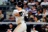 New York Yankees' Gio Urshela follows through on a two-run home run during the fifth inning of the team's baseball game against the Houston Astros on Saturday, June 22, 2019, in New York. (AP Photo/Frank Franklin II)