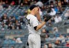 New York Yankees starting pitcher J.A. Happ reacts after giving up a three-run home run during the first inning of a baseball game against the Baltimore Orioles at Yankee Stadium, Sunday, March 31, 2019, in New York. (AP Photo/Seth Wenig)