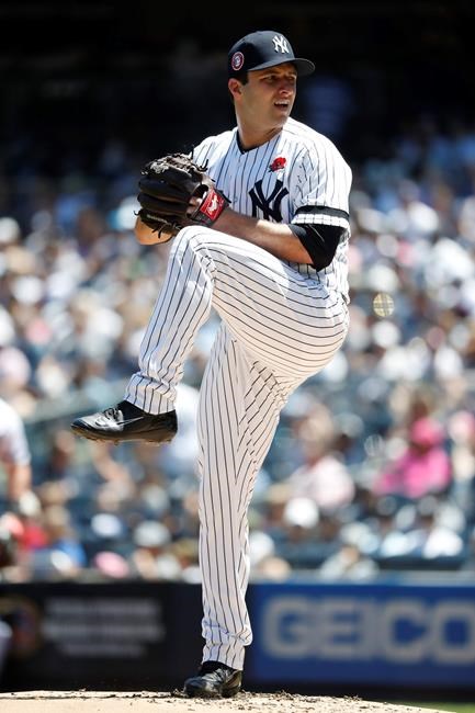 New York Yankees relief pitcher David Hale winds up against the San Diego Padres during the second inning of a baseball game, Monday, May 27, 2019, in New York. (AP Photo/Michael Owens)