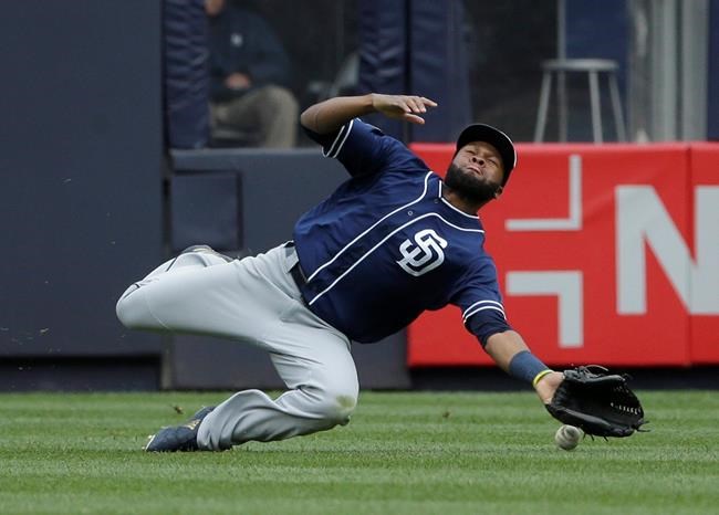 San Diego Padres center fielder Manuel Margot can't make the catch on a triple hit by New York Yankees' Luke Voit during the seventh inning of a baseball game at Yankee Stadium, Wednesday, May 29, 2019, in New York. (AP Photo/Seth Wenig)