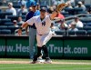 New York Yankees first baseman Kendrys Morales can't field the throw allowing New York Mets' Todd Frazier to reach first base during the fourth inning in the first baseball game of a doubleheader, Tuesday, June 11, 2019, in New York. (AP Photo/Frank Franklin II)