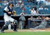 Arizona Diamondbacks' David Peralta (6) slides in to score on a sacrifice fly by Adam Jones, next to New York Yankees catcher Kyle Higashioka during the first inning of a baseball game Tuesday, July 30, 2019, in New York. The Diamondbacks won 4-2. (AP Photo/Frank Franklin II)