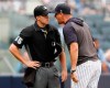 New York Yankees' Aaron Boone, right, gets in the face of home plate umpire Brennan Miller during the second inning of game one of a baseball doubleheader against the Tampa Bay Rays, Tuesday, July 16, 2019, in New York. Boone had already been ejected when he expressed his displeasure with the umpire's calls. (AP Photo/Kathy Willens)
