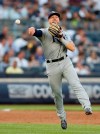 Tampa Bay Rays' third baseman Michael Brosseau throws to first on New York Yankees' Aaron Hicks' infield single during the second inning of a baseball game Monday, July 15, 2019, in New York. (AP Photo/Kathy Willens)