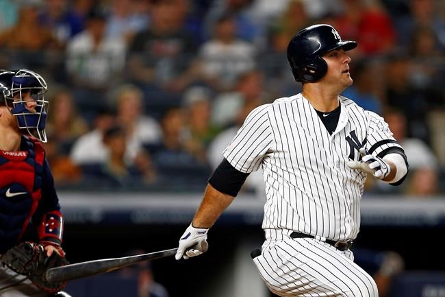 New York Yankees' Mike Ford follows through on an RBI single during the third inning of a baseball game against the Boston Red Sox on Sunday, Aug. 4, 2019, in New York. (AP Photo/Adam Hunger)