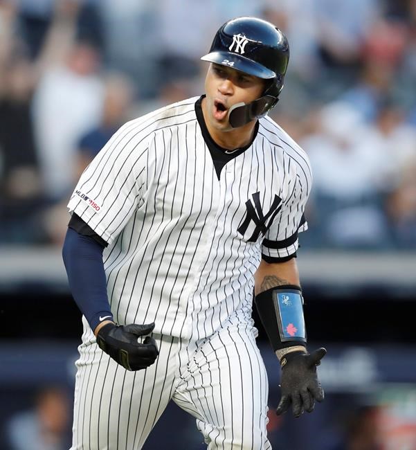 New York Yankees' Gary Sanchez reacts after hitting a two-run home run during the third inning of the team's baseball game against the Houston Astros, Friday, June 21, 2019, in New York. (AP Photo/Kathy Willens)
