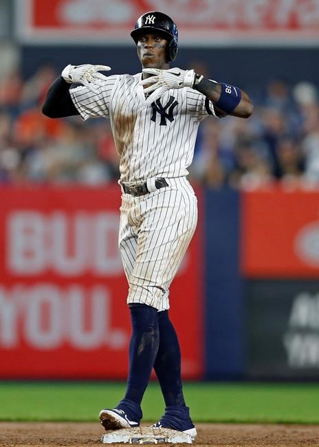 New York Yankees' Cameron Maybin reacts after hitting a two-run double during the fifth inning of the team's baseball game against the Houston Astros on Thursday, June 20, 2019, in New York. (AP Photo/Adam Hunger)