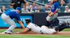 Toronto Blue Jays starting pitcher Clayton Richard, left, tags out New York Yankees' Giancarlo Stanton at third during the first inning of a baseball game Tuesday, June 25, 2019, in New York. Stanton left the game after the third inning. (AP Photo/Kathy Willens)