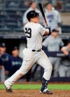 New York Yankees Gio Urshela watches his game-tying, two-run home run during the ninth inning of the team's baseball game against the Seattle Mariners, Tuesday, May 7, 2019, in New York. The Yankees won 5-4. (AP Photo/Kathy Willens)