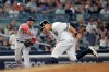 Boston Red Sox third baseman Rafael Devers, left, throws to first base as New York Yankees' Kendrys Morales ducks, on a bases-loaded groundout by Gio Urshela to end the fifth inning of a baseball game Saturday, June 1, 2019, in New York. (AP Photo/Julio Cortez)