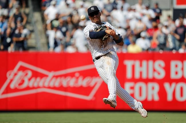 New York Yankees second baseman Gleyber Torres makes a throw to first base for the final out against the Boston Red Sox in the ninth inning of a baseball game, Saturday, Aug. 3, 2019, in New York. (AP Photo/Michael Owens)