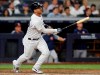New York Yankees' Gleyber Torres watches his two-run home run during the seventh inning of the team's baseball game against the Houston Astros, Friday, June 21, 2019, in New York. (AP Photo/Kathy Willens)