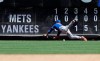 New York Mets right fielder Michael Conforto misjudges a ball hit by New York Yankees' Brett Gardner for an RBI triple during the fifth inning in the first game of a baseball doubleheader Tuesday, June 11, 2019, in New York. (AP Photo/Frank Franklin II)