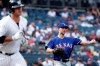 Texas Rangers pitcher Mike Minor, right, throws out New York Yankees designated hitter Mike Ford during the first inning of a baseball game Monday, Sept. 2, 2019, in New York. (AP Photo/Adam Hunger)
