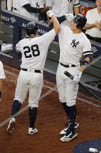 New York Yankees' Aaron Judge, right, celebrates with Austin Romine (28) after Romine hit a two-run home run during the seventh inning of a baseball game against the Arizona Diamondbacks Wednesday, July 31, 2019, in New York. (AP Photo/Frank Franklin II) WBB
