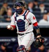 Boston Red Sox catcher Sandy Leon returns to his position after picking up a foul ball during the sixth inning of the team's baseball game against the New York Yankees, Tuesday, April 16, 2019, in New York. (AP Photo/Kathy Willens)