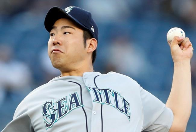 In this Wednesday, May 8, 2019, photo, Seattle Mariners starting pitcher Yusei Kikuchi winds up during the team's baseball game against the New York Yankees in New York. A day after a dark substance was spotted under the bill of Kikuchi's cap in a win at Yankee Stadium — possibly illegal pine tar — all sides kept cool. MLB issued no penalty or even a statement on the matter Thursday.