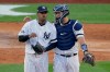 New York Yankees catcher Gary Sanchez talks on the mound with starting pitcher Luis Severino (40) during the fourth inning of Game 3 of baseball's American League Championship Series against the Houston Astros, Tuesday, Oct. 15, 2019, in New York. (AP Photo/Seth Wenig)
