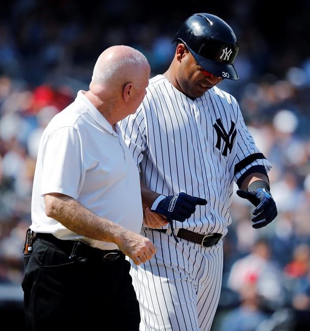 ADDS NAME OF TRAINER - New York Yankees' Edwin Encarnacion is helped by trainer Steve Donohue after being hit by a pitch thrown by Boston Red Sox's Josh Smith during the eighth inning of a baseball game Saturday, Aug. 3, 2019, in New York. Encarnacion suffered a broken right wrist. (AP Photo/Michael Owens)