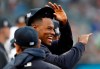 Injured New York Yankees pitcher Luis Severino smiles as he watches the first inning of the team's baseball game against the Boston Red Sox on Tuesday, April 16, 2019, in New York. (AP Photo/Kathy Willens)