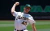 Oakland Athletics pitcher Chris Bassitt (40) throws to a Baltimore Orioles batter during the first inning of a baseball game in Oakland, Calif., Wednesday, June 19, 2019. (AP Photo/Jeff Chiu)