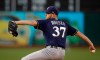 Milwaukee Brewers pitcher Adrian Houser works against the Oakland Athletics during the first inning of a baseball game Tuesday, July 30, 2019, in Oakland, Calif. (AP Photo/Ben Margot)
