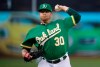 Oakland Athletics pitcher Brett Anderson works against the Texas Rangers in the first inning of a baseball game, Thursday, July 25, 2019, in Oakland, Calif. (AP Photo/Ben Margot)